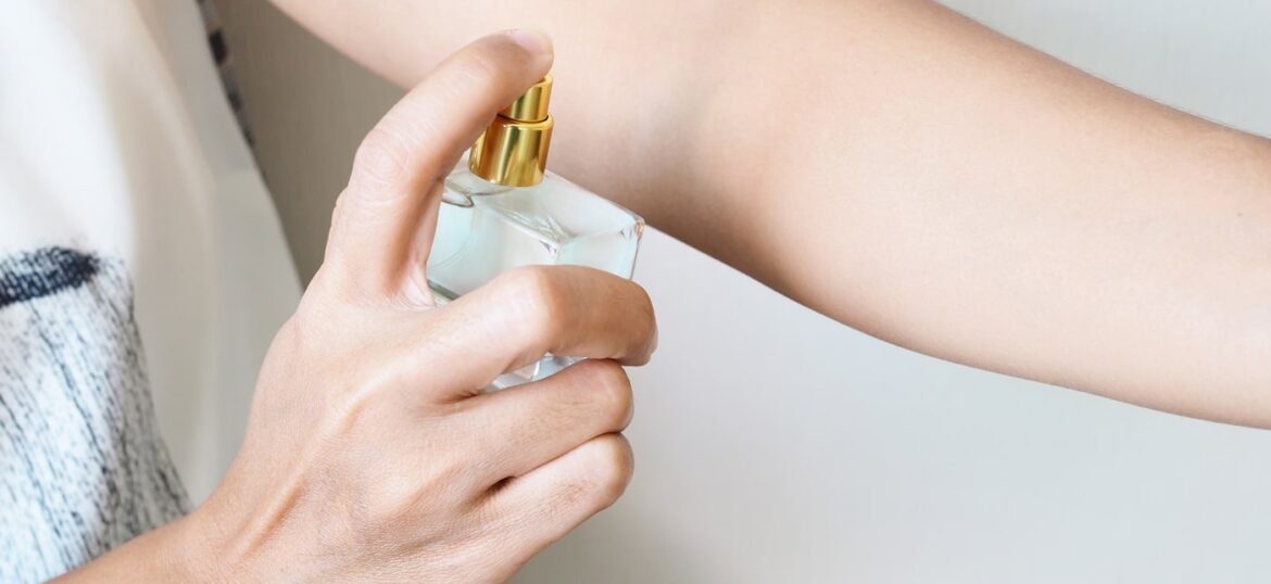 close-up-woman-spraying-perfume-arms-add-fragrance-body close-up-woman-spraying-perfume-arms-add-fragrance-body